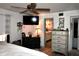 Bedroom with a dresser and decor in the corner; a door leads to the bathroom at 25600 Se 152Nd Pl, Umatilla, FL 32784