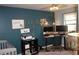 Functional office with a modern desk setup and an inspiring gallery wall for creative work at 25600 Se 152Nd Pl, Umatilla, FL 32784
