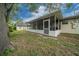 The property has a large backyard and a screened in porch at 5018 Se 106Th Pl, Belleview, FL 34420