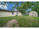 A well-maintained backyard with a storage shed provides ample space for outdoor activities and storage solutions at 5018 Se 106Th Pl, Belleview, FL 34420