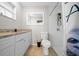 Cozy bathroom with updated tiled shower, modern toilet, and granite vanity at 5018 Se 106Th Pl, Belleview, FL 34420
