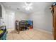 Clean and spacious bedroom with tile floors and natural lighting at 5018 Se 106Th Pl, Belleview, FL 34420