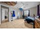 Bright bedroom features tile flooring, ceiling fan, and a window with natural light at 5018 Se 106Th Pl, Belleview, FL 34420
