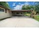 Attached carport providing convenient parking and shelter from the elements at 5018 Se 106Th Pl, Belleview, FL 34420