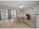 Bright dining room with French doors, tile floors, and a traditional dining set at 5018 Se 106Th Pl, Belleview, FL 34420
