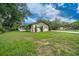 Exterior view of the home and front lawn at 5018 Se 106Th Pl, Belleview, FL 34420