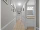 Hallway with neutral walls, tile floors, and access to bathroom and bedrooms at 5018 Se 106Th Pl, Belleview, FL 34420