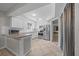 Modern kitchen with stainless steel appliances, tile flooring, and white cabinets at 5018 Se 106Th Pl, Belleview, FL 34420