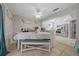 Bright eat-in kitchen with stainless appliances, white cabinetry, and a neutral color palette at 5018 Se 106Th Pl, Belleview, FL 34420
