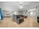 Open concept living room showcases tile flooring, neutral walls, and a kitchen/dining area at 5018 Se 106Th Pl, Belleview, FL 34420