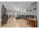 Comfortable living room with tile floors, a large sofa, and plenty of natural light at 5018 Se 106Th Pl, Belleview, FL 34420