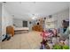 Spacious main bedroom featuring a ceiling fan, natural light, and tiled flooring at 5018 Se 106Th Pl, Belleview, FL 34420