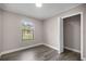 Bright bedroom with a window, closet, neutral paint and hard surface flooring at 6021 Nw 54Th Ter, Ocala, FL 34482