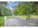 Spacious deck provides an inviting outdoor space for relaxation and entertaining, overlooking the lush backyard at 6021 Nw 54Th Ter, Ocala, FL 34482