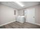 Practical laundry room complete with washer, dryer, and ample space at 6021 Nw 54Th Ter, Ocala, FL 34482