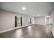 Bright living room with hard surface floors, neutral paint and views of the front yard at 6021 Nw 54Th Ter, Ocala, FL 34482