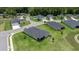 Areal shot showcasing the property within a picturesque neighborhood with mature trees and manicured lawns at 7828 Sw 74Th Loop, Ocala, FL 34481