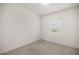 A bright bedroom featuring neutral carpet, and a window to let in natural light at 7828 Sw 74Th Loop, Ocala, FL 34481
