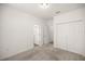 Bedroom with neutral carpet, closet, and doors to other rooms at 7828 Sw 74Th Loop, Ocala, FL 34481