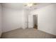 Bedroom with carpet, ceiling fan, and doorways to a closet and ensuite bathroom at 7828 Sw 74Th Loop, Ocala, FL 34481