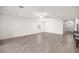 Open-concept living room with tile flooring, white walls, and recessed lighting, showcasing spaciousness at 7828 Sw 74Th Loop, Ocala, FL 34481