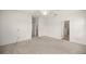Spacious main bedroom with carpet flooring, ceiling fan, and ensuite bathroom access at 7828 Sw 74Th Loop, Ocala, FL 34481