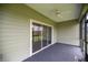 Screened porch with view to the outdoors through the screens at 7828 Sw 74Th Loop, Ocala, FL 34481