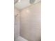 Close up of shower with tiled walls and shower head at 7828 Sw 74Th Loop, Ocala, FL 34481