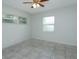Bright bedroom with tile floors, neutral walls, and plenty of natural light at 956 Osceola Trl, Casselberry, FL 32707