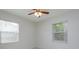 Bright bedroom with ceiling fan, and two windows allowing natural light at 956 Osceola Trl, Casselberry, FL 32707