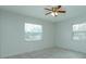 Comfortable bedroom with tile flooring, ceiling fan, and lots of natural light at 956 Osceola Trl, Casselberry, FL 32707