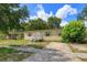 Inviting single-story home with a well-lit entry and a spacious front yard at 956 Osceola Trl, Casselberry, FL 32707