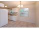 Kitchen featuring white cabinetry, granite countertops, and tile flooring at 956 Osceola Trl, Casselberry, FL 32707