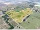 Scenic aerial view showcasing the expansive property, ponds, pastures, and surrounding landscape inside the property line at 4880 Bannon Island Rd, Haines City, FL 33844