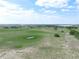 A beautiful parcel showcasing open pastures,scattered trees,a small pond and buildings in the distance at 4880 Bannon Island Rd, Haines City, FL 33844