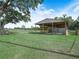 Outdoor barn with stalls offers shelter and space for horses and livestock on lush green property at 4880 Bannon Island Rd, Haines City, FL 33844