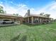 Charming country home with a long covered porch, stone accents, and a two-car carport at 4880 Bannon Island Rd, Haines City, FL 33844