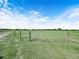 Fenced pastureland provides secure grazing for livestock and animals under a bright sky at 4880 Bannon Island Rd, Haines City, FL 33844