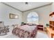 Relaxing bedroom with a rocking chair and large window at 3082 Landings Ct, Haines City, FL 33844