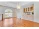 Bright dining room featuring hardwood floors and built-in hutch at 3082 Landings Ct, Haines City, FL 33844