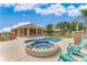 Relaxing pool and spa area with patio chairs at 3082 Landings Ct, Haines City, FL 33844