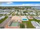An aerial view of community amenities: a shuffleboard court and swimming pool at 6739 Kensington Ne Dr, Winter Haven, FL 33881