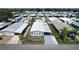 Aerial view of a well-maintained mobile home community with tidy landscaping and paved streets at 6739 Kensington Ne Dr, Winter Haven, FL 33881
