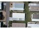 This aerial view shows a well-maintained neighborhood with neat mobile homes and paved roads at 6739 Kensington Ne Dr, Winter Haven, FL 33881