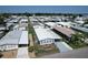 Aerial view showcasing a well-planned mobile home community, neatly arranged with various home styles at 6739 Kensington Ne Dr, Winter Haven, FL 33881