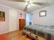 Comfortable bedroom with a country design and decor, wood flooring, and a full size bed at 6739 Kensington Ne Dr, Winter Haven, FL 33881