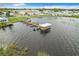 This aerial view displays the boat docks and easy lake access, ideal for boating and recreation at 6739 Kensington Ne Dr, Winter Haven, FL 33881