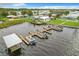 Aerial view featuring multiple boat docks, perfect for water enthusiasts and lake access at 6739 Kensington Ne Dr, Winter Haven, FL 33881