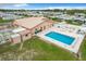 A high angle shows a community pool and shuffleboard court, both great recreational opportunities at 6739 Kensington Ne Dr, Winter Haven, FL 33881