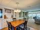 Dining area with wood floors and built in shelving at 6739 Kensington Ne Dr, Winter Haven, FL 33881